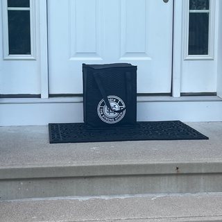A Strong Kitchen delivery bag on a customer’s doormat